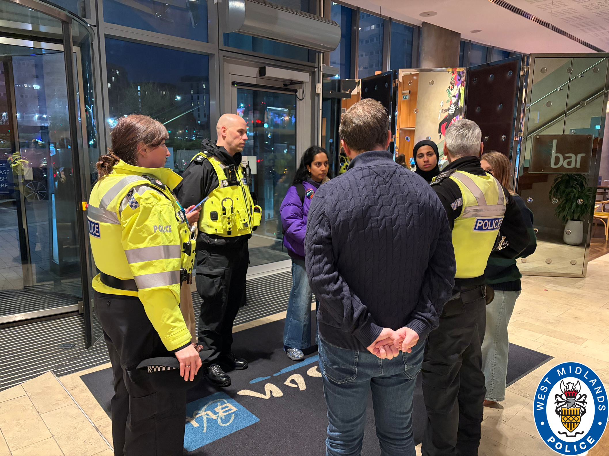 Officers talking with 'the girls group' in a night club
